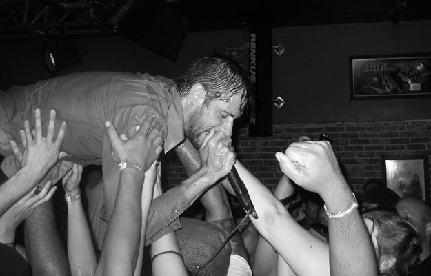 Mike Wiebe of The Riverboat Gamblers crowd surfs at The Slide Bar in Anaheim