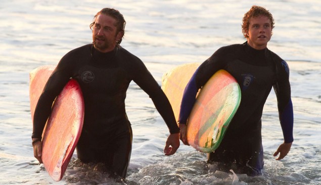 Gerard Butler and Jonny Weston making their way out of the water during a scene in Chasing Mavericks. Photo: 20th Century Fox