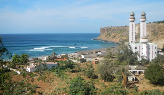 A large Mosque overlooks a traditional fishing village and one of the best waves in Dakar. Image: Persaud