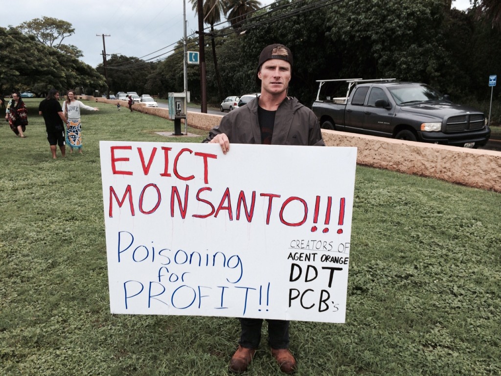 Mark Healey protests Monsanto and GMOs in Hawaii. 