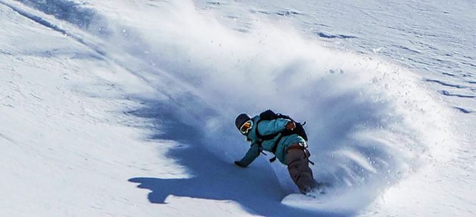 Alexa Hohenberg snowboarding in Alaska