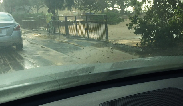 The scene where the rogue wave went up on the road, knocking over Sarah and her son. Photo: Chris White