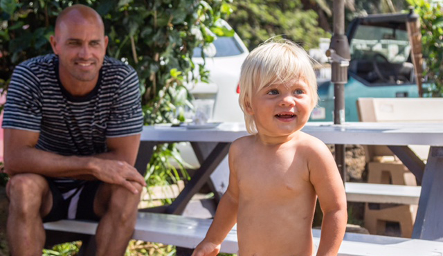 Kelly Slater catches up with Van after him and his mother were taken out by a rogue wave. Photo: Chris White