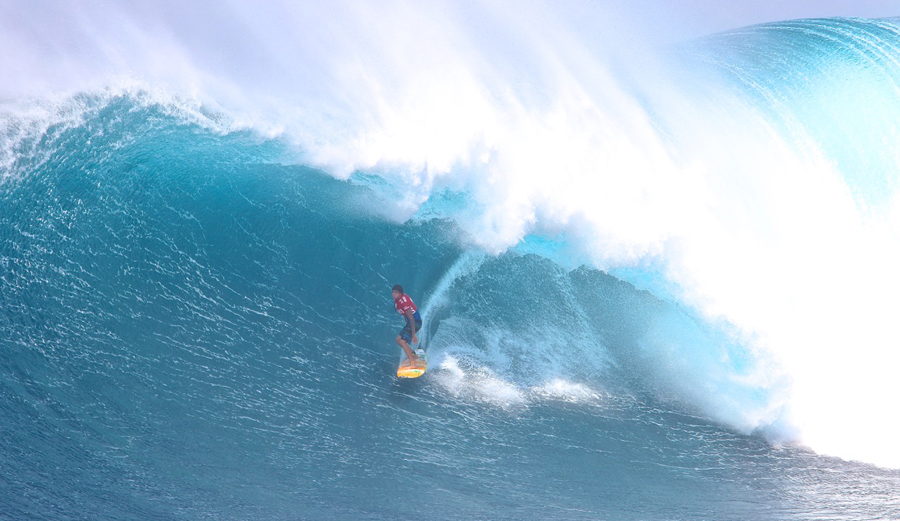 Albee Layer, pushing the limits in terms of big wave barrel-riding. Here he is standing tall in a Pe'ahi cavern. Credit: DoomaPhotos