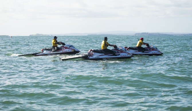 Kalani Vierra, Kaeo Lopez and Kaleo Lopez patrol the Waka Ama race course of The Ultimate Waterman competition in Aucland, New Zealand. Photo: Mike Smolowe