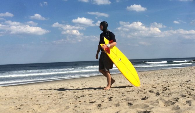 The author, taking advantage of the underused hooded short-arm rash guard in Asbury Park, NJ.  Photo credit: @Ianherenow