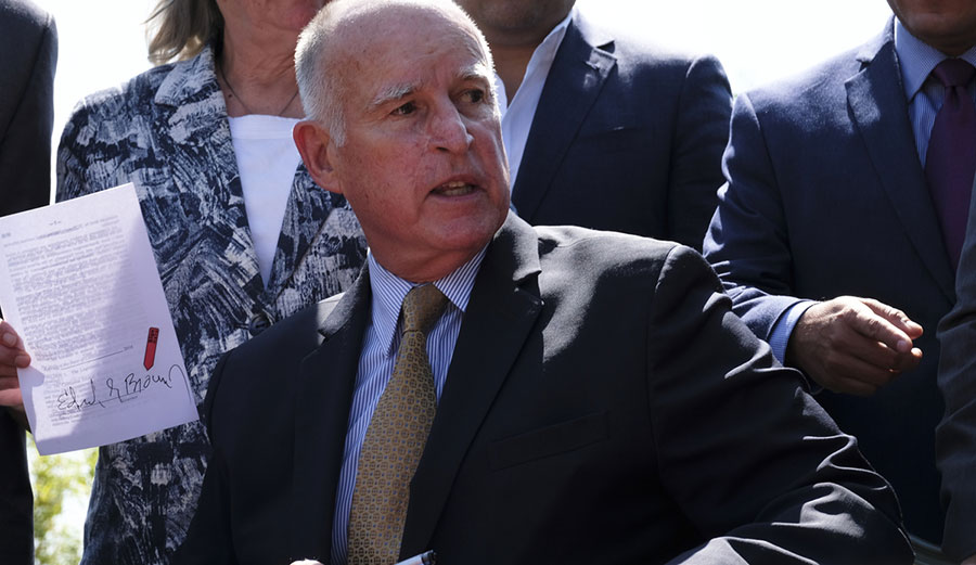 Governor Jerry Brown just signed to remarkable bills combatting climate change. Photo: Richard Vogel/AP