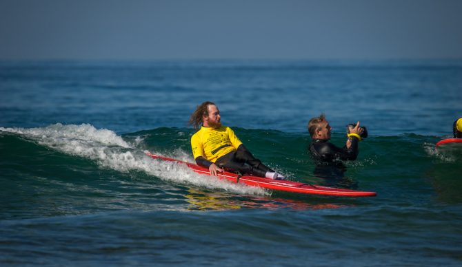 local clinic participant Mike Robbins-Waid gliding down the line. Photo: ISA/Sean Evans