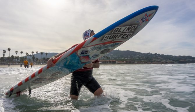 Team USA's Scott Leason on his way back out to the line-up during Heat 1 of the AS-VI Division. Photo: ISA/Sean Evans