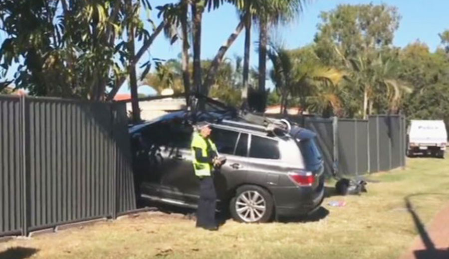 Police at the scene of the wreck of the car driven by Dean Mercer. Photo: ABC