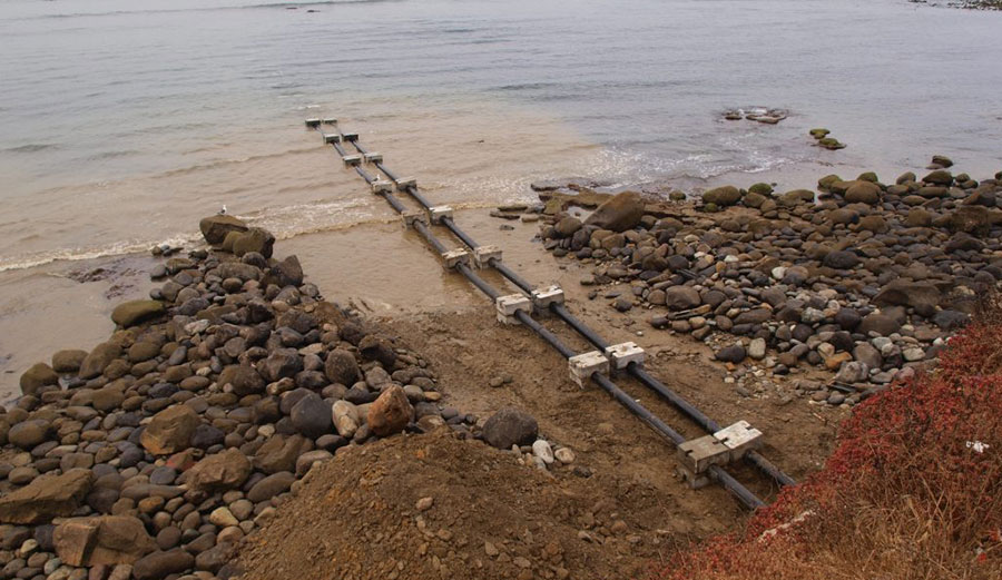 SENFU Mexico, a seafood exporter, installed two pipelines into the break at Tres Emes, part of the Bahia de Todos Santos World Surfing Reserve.