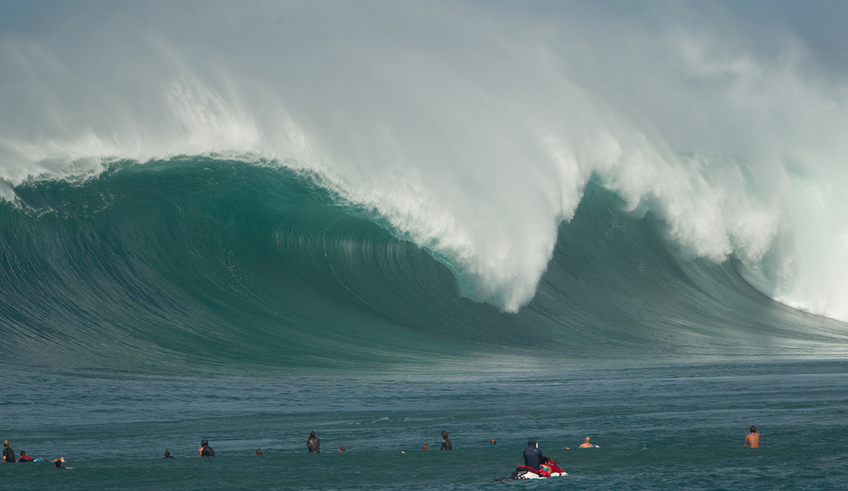 Waimea Bay lineup  shot. This is far out from a friend\'s roof. It\'s as close to a water angle from the beach as you can get. This one went unridden. Photo: <a href=\"http://www.brianbielmann.com\">BrianBielmann.com</a>