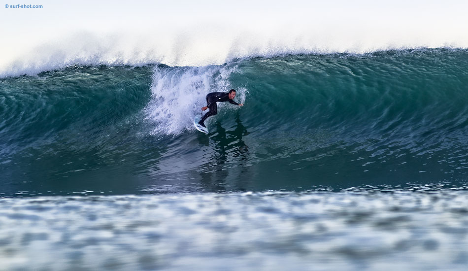 Cameron Aldrich anticipates the payoff from a well-timed drop.  Photo: Chuck Schmid/<a href=\"http://surf-shot.com/\" target=\"_blank\">Surf-Shot.com</a>