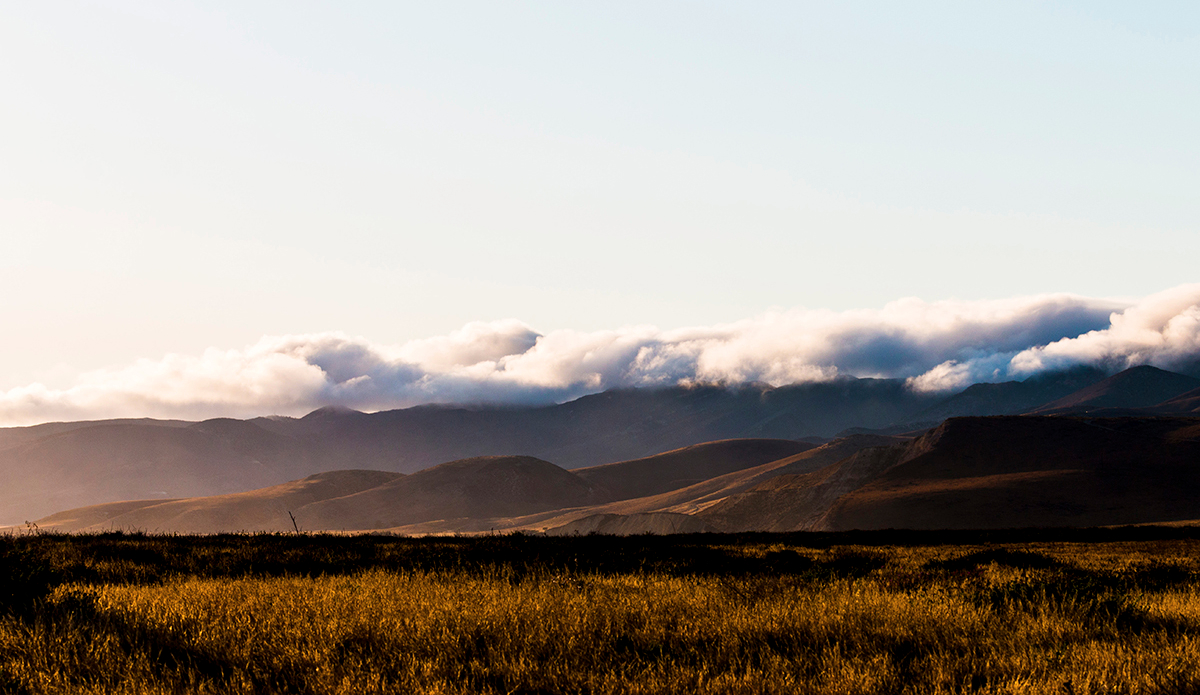 These rolling hills ran into the ocean, holding back a dense layer of clouds and allowing the sun to shine all day—the stars shone all night, too.  Photo: <a href=\"http://www.corygehrphoto.com/\">Cory Gehr Photography</a>