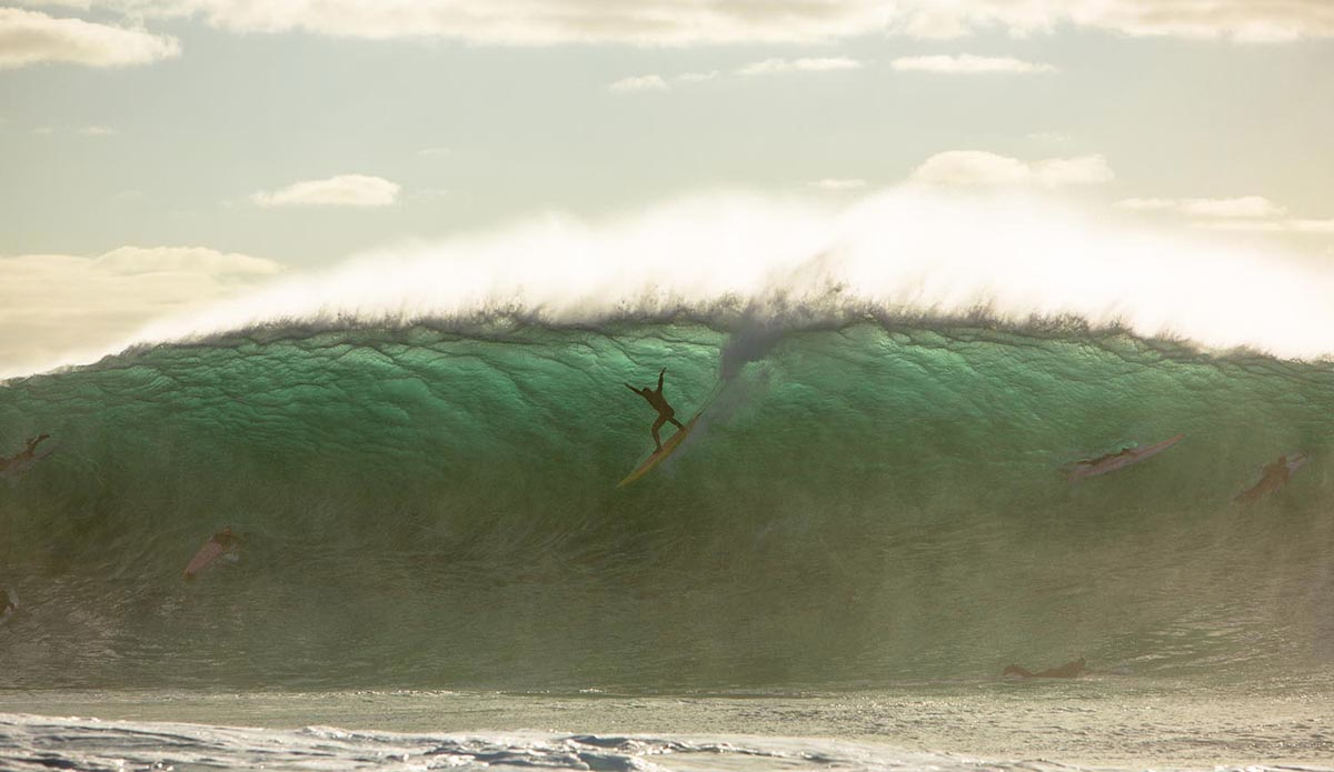 South Africa’s \"Sunset\" is one of its prized big-wave spots just across the bay from Dungeons. Being a more perfectly shaped reef, it looks more inviting than, say, Dungeons. But due to its wedging, focused nature, it’s actually far more dangerous and powerful at times, trapping surfers in the impact zone and dealing out multiple wave hold-downs. Upcoming star James Lowe from Kommetjie above the zone.  Photo: <a href=\"https://instagram.com/alanvangysen\">Alan Van Gysen</a>