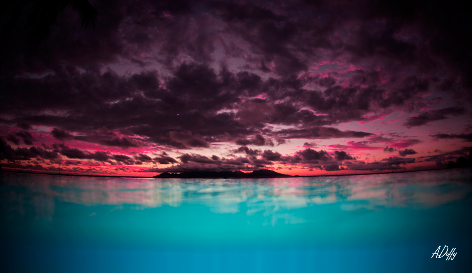 Beautiful sunsets are a daily occurrence in Tahiti. Here, I\'ve filled the aqua-blue water with my underwater flash system. Photo: <a href=\"http://adamduffyphotography.com/\">Adam Duffy.</a>