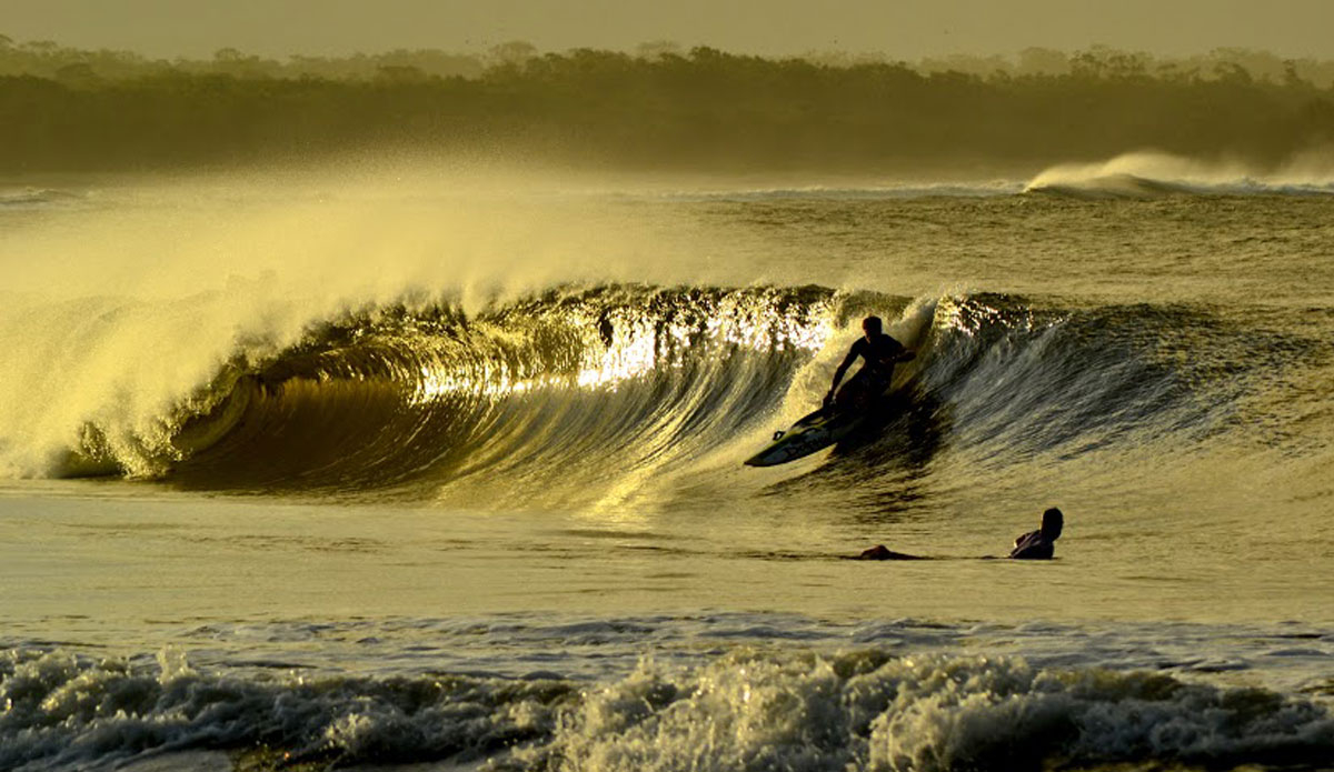 A surfer’s arch nemesis, the clubby, pulls into a golden tube that only a surfer could dream of. Photo: <a href=\"http://instagram.com/alexbenaud\">Alex Benaud