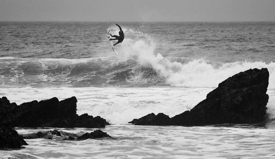 Alan Stokes adding a little flair to a murky day at Fistral. 