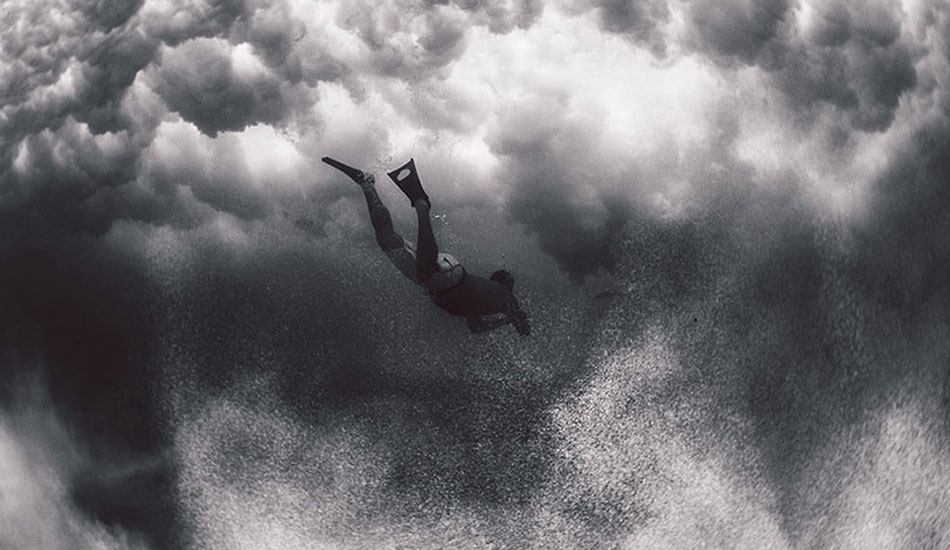 Unknown swimmer diving under the clouds at Makapu\'u. Photo: <a href=\"http://www.gagehingeley.com/\" target=_blank>Gage Hingeley</a>.