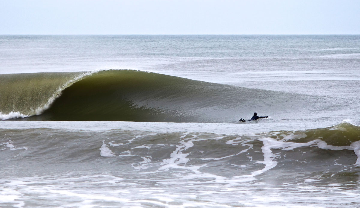 This is the most important photo that really got me recognized and still is a lot of people\'s favorite shot of New Jersey. It\'s the best picture I\'ve ever taken in regards to surfer\'s position on the paddle and the perfect form of the wave. I took this not long after we were able to move back onto the island after Hurricane Sandy hit. This was taken in Midway Beach, NJ. Photo: <a href=\"http://bencurriephoto.zenfolio.com/\">Ben Currie</a>