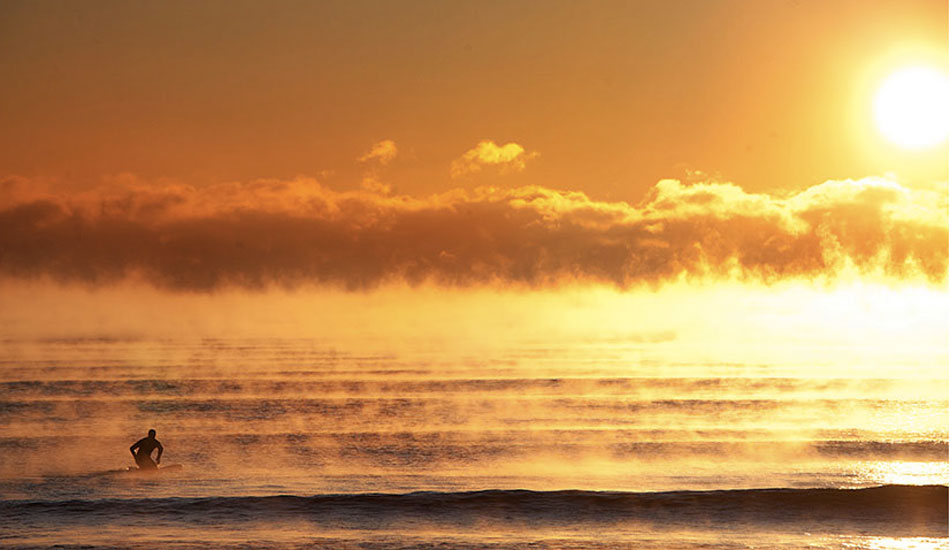 Bryan Johnson gets a solo session in on a below zero morning. That\'s seasmoke on the surface caused by frigid temps hitting the high-30 water temps. Photo: <a href=\"http://www.briannevins.com/\" target=\"_blank\">Brian Nevins</a> from <a href=\"http://www.theinertia.com/surf/winter-surfing-in-new-hampshire/\" target=\"_blank\">Frigid Winter Surfing in New Hampshire</a>