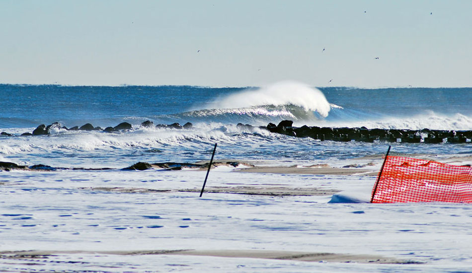 Snow-covered beaches halt crews from dredging, giving this sandbar a little extra longevity. Photo: Tim Leopold from <a href=\"http://www.theinertia.com/surf/snow-folio-tim-leopold/\" target=\"_blank\">Snow-folio: Tim Leopold</a>