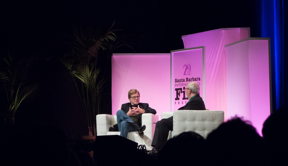 Robert Redford talking with interviewer Leonard Maltin who did a great job listening and talking with him and giving the conversation room to breathe. Robert Redford was in rare form this night going into great detail about his rough childhood to becoming an actor to transitioning into directing. Butch Cassidy and the Sundance Kid was a story he could really relate to. His most recent film, All Is Lost, brought him back to his surfing days since he didn\'t have much prior sailing experience. Photo: <a href=\"http://lowtiderising.com/\" target=_blank>Branden Aroyan/lowtiderising.com</a>