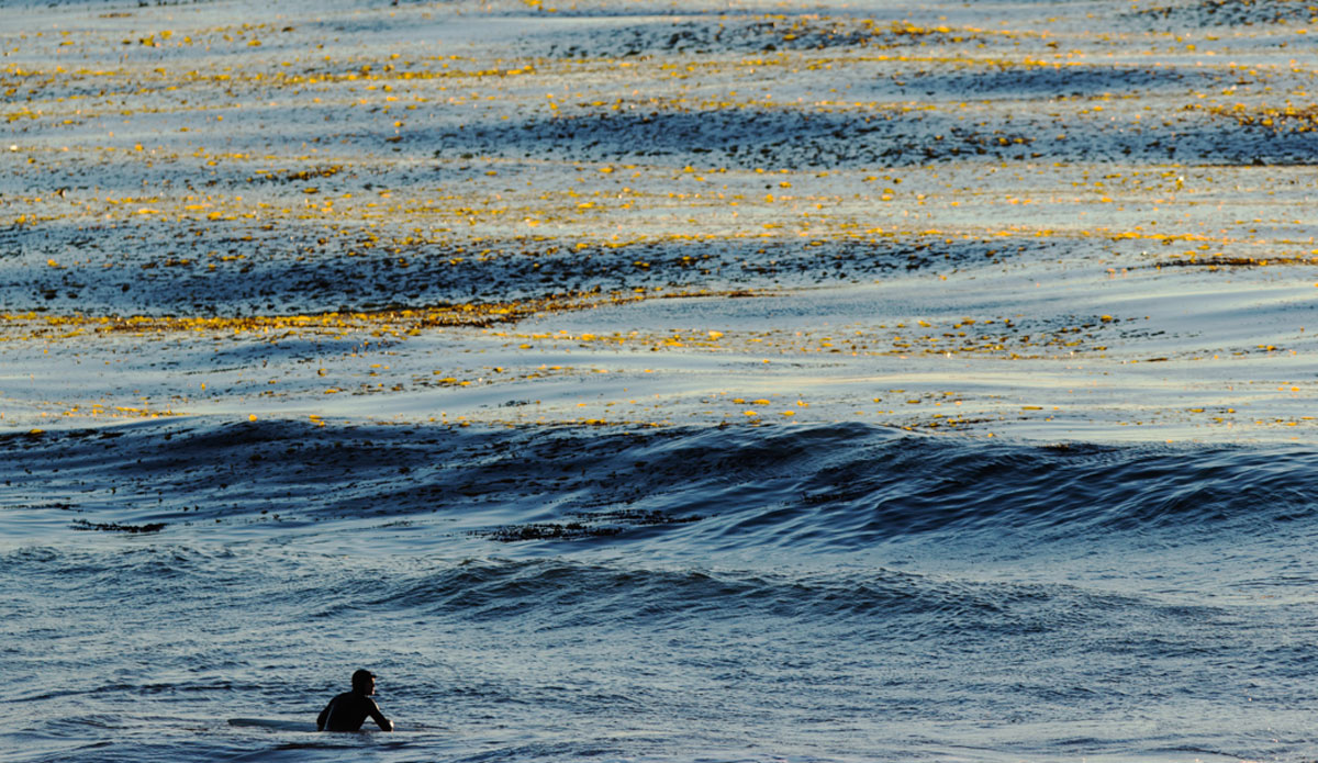 Solitude.  I love being able to capture surfers sitting and admiring the ocean.  It\'s the whole reason we go out there. To get away from today\'s world and enjoy nature. Photo: <a href=\"http://www.kincaidcliffordphotography.com/\"> Brian Clifford</a>