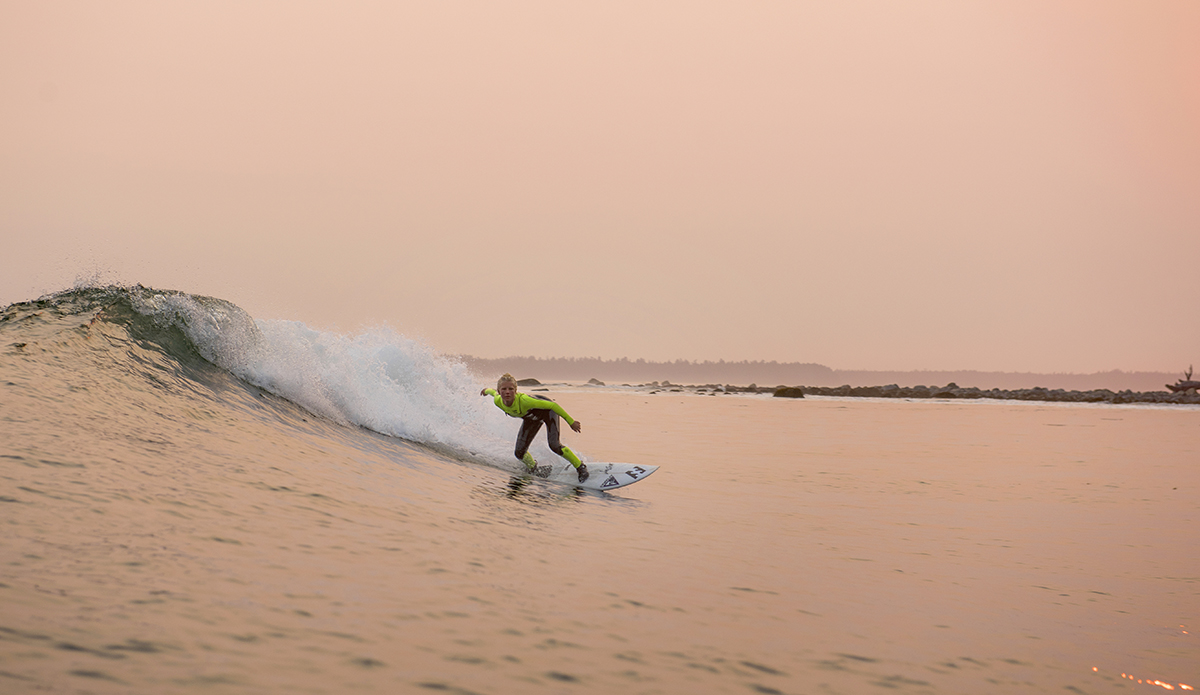 Mathea Olin surfs through the forest fire haze on Vancouver Island, on August 04, 2017. (Bryanna Bradley)