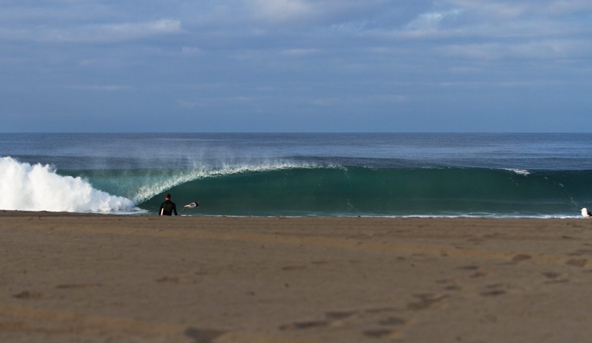 An unkown surfer heading out to a perfect Los Angeles morning. Photo: <a href=\"http://www.kincaidcliffordphotography.com/\"> Brian Clifford</a>