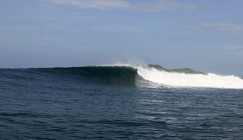 One of the few unridden set waves rolls through. Photo: <a href=\"http://www.isawsg.com/\" target=_blank>Philippe Demarsan</a>.