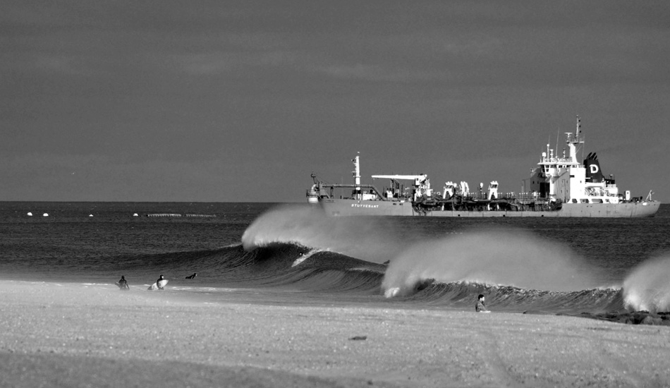 Good ol\' dredger doing its dirty work off Monmouth County. Some surfers get some good ones before this monster does its damage. Photo: Chris Centrella