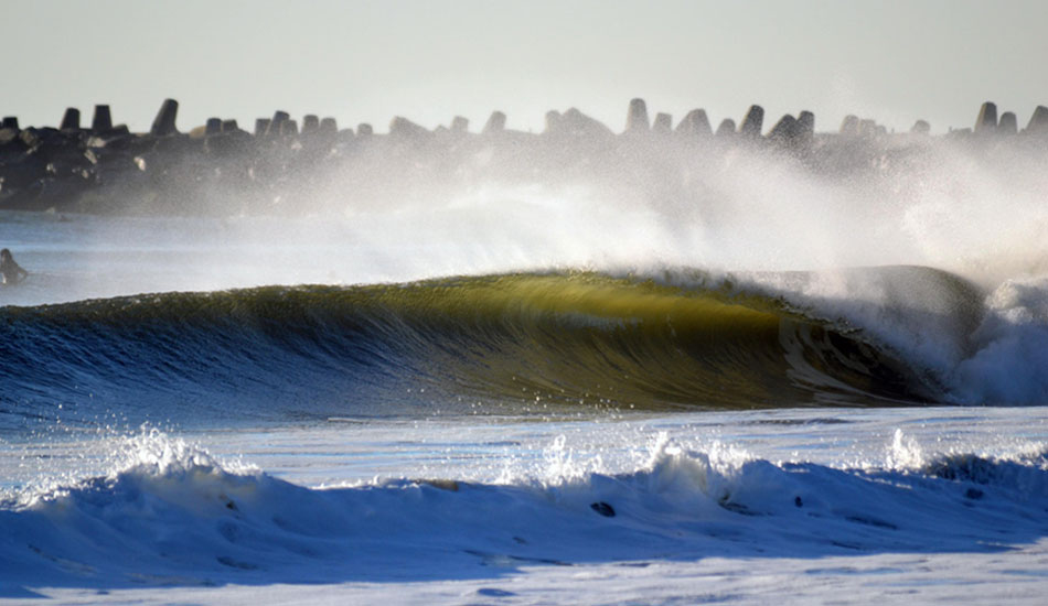 One of the thicker waves of the day left untouched and perfect to shoot. Some of the surfers just stared in awe at this one and the people on the beach were in even more excitement over the rights off of the inlet. Photo: Chris Centrella