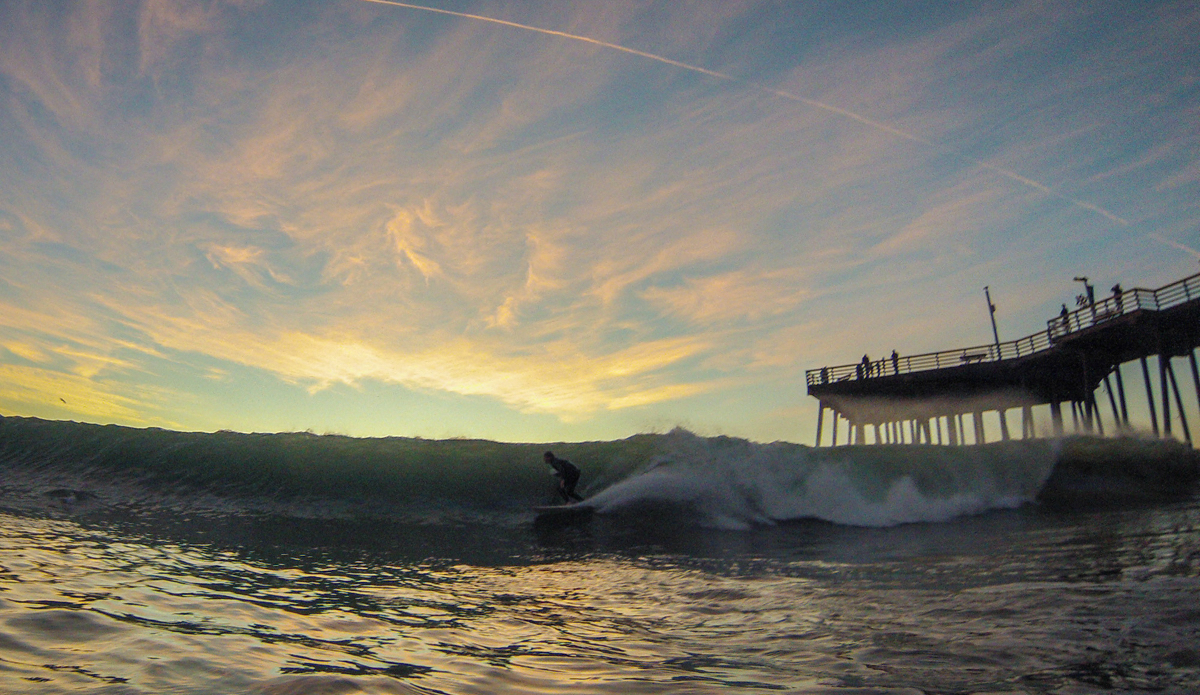 Glowing sunsets and pumping surf. Photo: <a href=\"http://www.colinrothphoto.com\">Colin Roth</a>