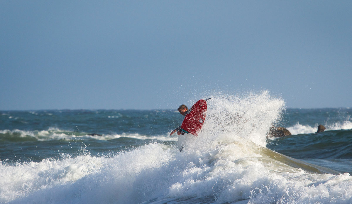 Small pulses, big moves. Braden Jones launching against the winds. Photo: <a href=\"http://www.colinnearman.com\">Colin Nearman</a>