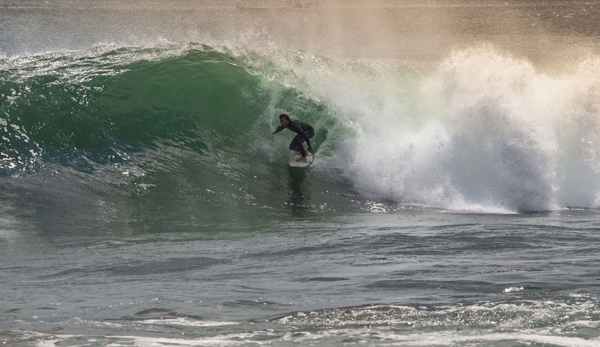 Raven Lundy, looking out from the mouth of a Cristobal shack. Photo: <a href=\"http://www.jwdproductions.com/\"> Joey Dwyer</a>