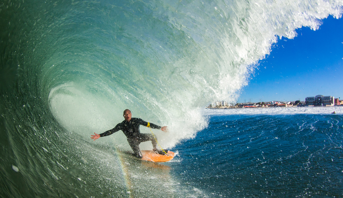 This is my good friend (and DK legend) Manny Vargas. He was a charger in the 90\'s and he\'s still charging! He goes on the biggest barrels and arms spread all the time just making my job easier to take a nice photo. I remember calling him a night before letting him know it was going to be good next day and this is what we were scored! Photo By: Damian Davila