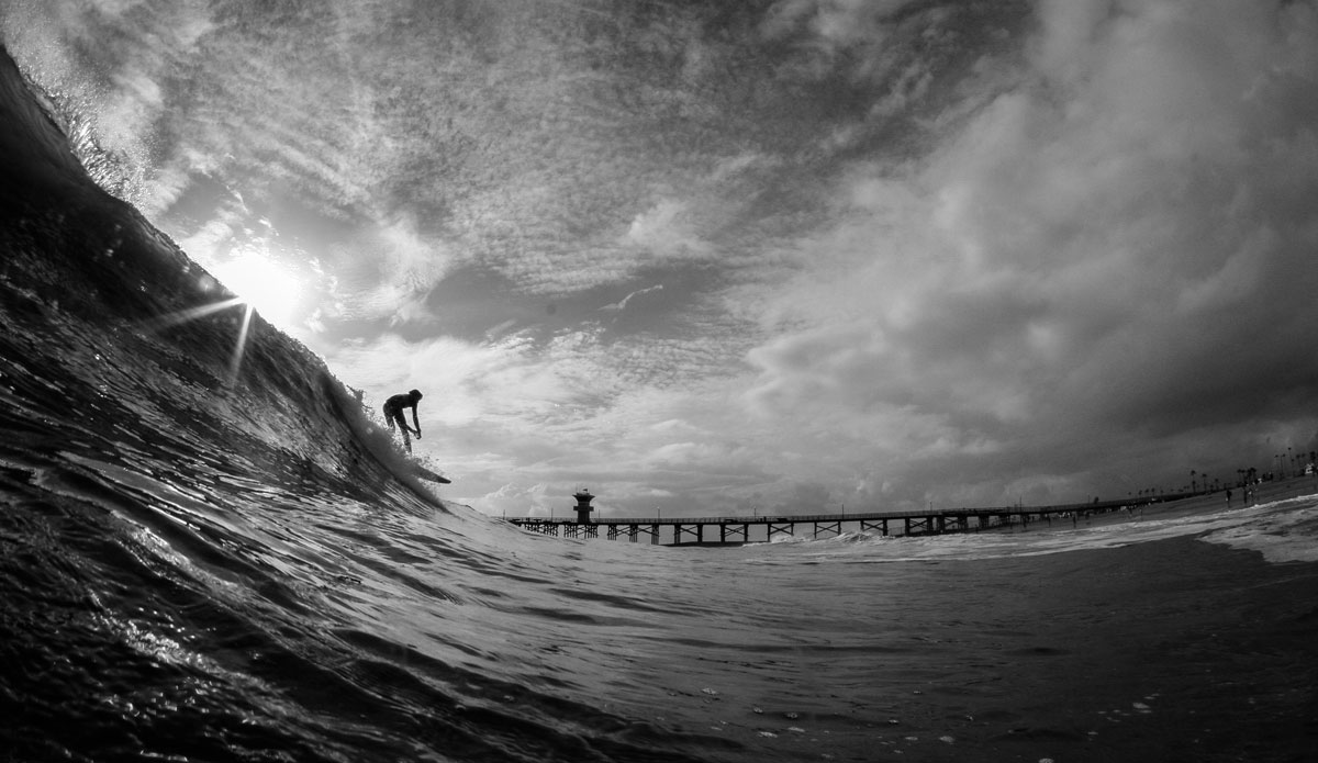 Unknown rider at seal beach during a stormy day with filthy water. Photo: <a href=\"http://instagram.com/danny_nieves\"> Danny Nieves</a>