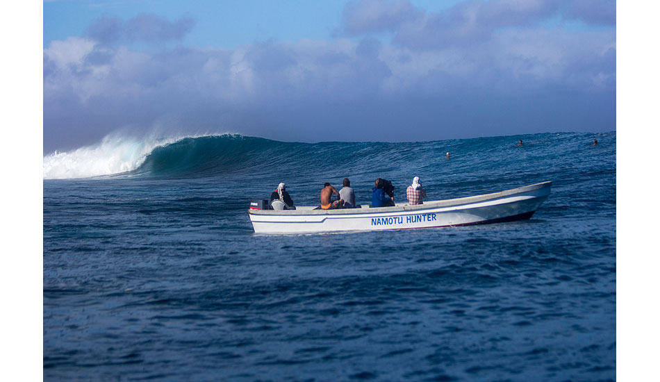 Just an empty at Cloudbreak with the boat from Namotu watching. Photo: <a href=\"http://www.davenilsenphotography.com/\">Dave Nilsen</a>