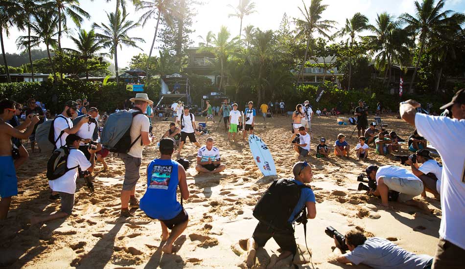 Mick Fanning, meditates before his heat with a circle of photographers capturing the moment. Photo: <a href=\"http://mattdunbar.com.au\">Matt Dunbar</a>