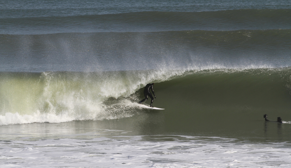 Jesse Hines and Matt Lusk. Jesse Hines and photographer Matt Lusk\'s moment of connection! Water photography is only for the tough here in the winter. Photo: Mickey McCarthy