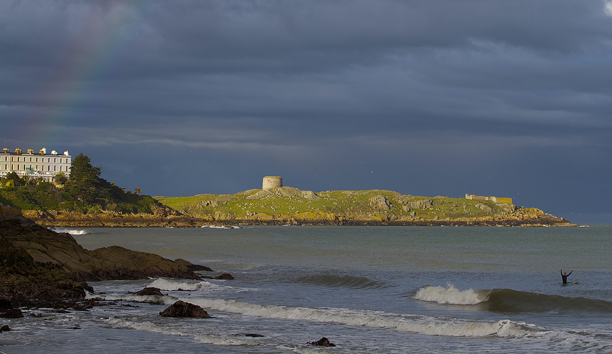 Stunning surfing backdrop complete with a rainbow all captured 30 minutes from Dublin\'s city center on a small clean day with a Martello Tower in the background from the 1800\'s. Photo: UnaMaryMcCarthyDeering