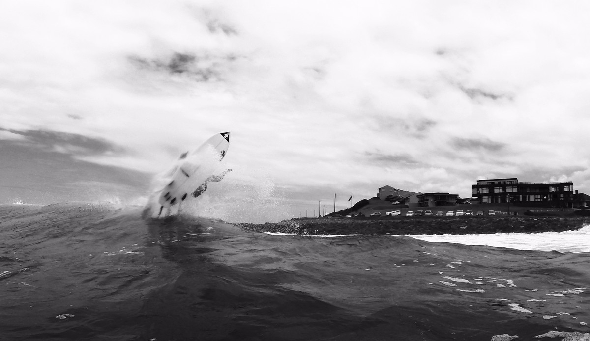 Jono lifting off at his local spot. I like to go with the black and white option on cloudy overcast days. It adds drama. Photo: Pierre de Villiers