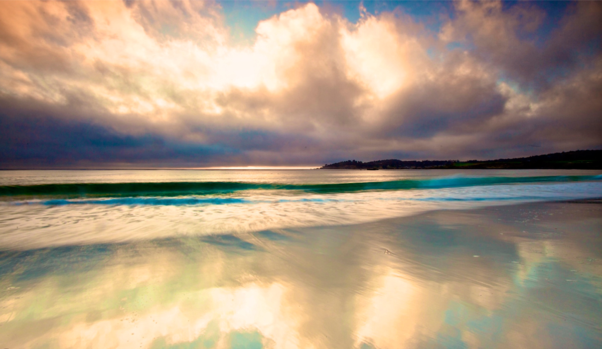 Carmel California, Sunset just passed and the sky was still bright enough to capture the reflections off the sand.  Image: <a href=\"http://gokenji.com/port/\" target=\"_blank\">Croman</a>