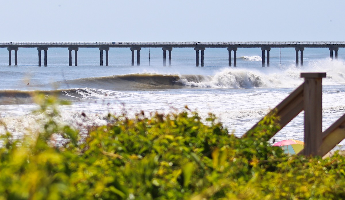 Virginia Beach\'s Shaun Devine drives away from the pier and into the zone. Photo: <a href=\"http://jettylife.com/\">John Streit.</a>