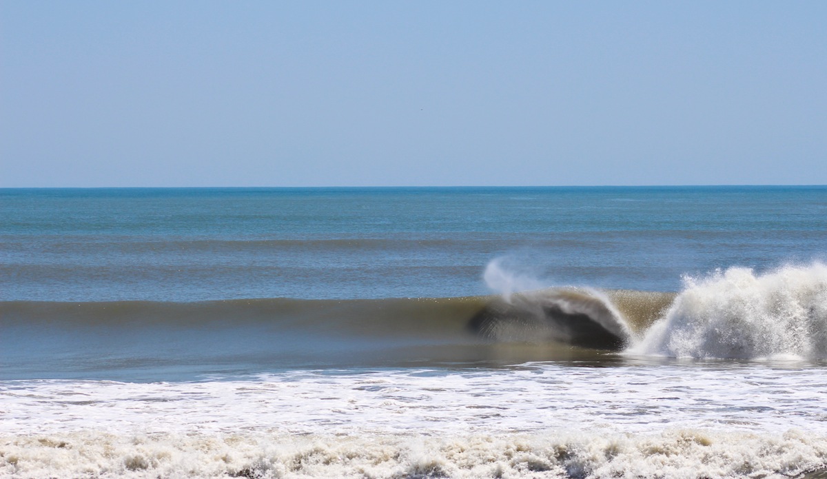 This is one of my favorites from the session. Check out the ripples on the wave face from the spitting barrel. That\'s as clean as it gets on the Outer Banks. Photo: <a href=\"http://jettylife.com/\">John Streit.</a>