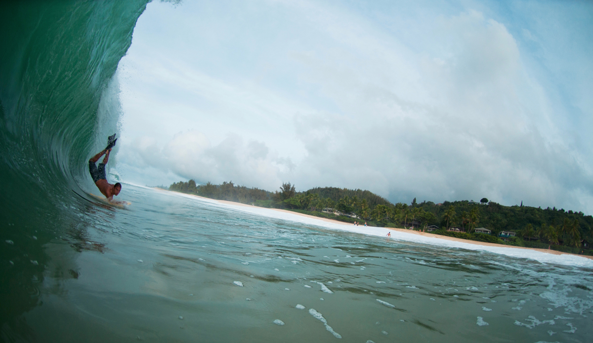 Scorpion Drop: This is me at Ke iki scorpion-ing in 2011. OTW and Pipe were a zoo (typical) so my friend Morgan and I went and pulled into some shore pound in front of Clark Little. Photo: Clark Little