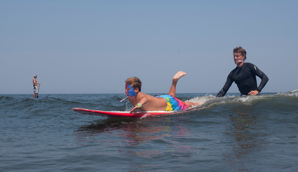 Here is Adam again, pushing Kevin into the first wave he ever stood up on. Kevin felt like he was on top of the world. Image: <a href=\"http://mikeincitti.com/\" target=\"_blank\">Incitti</a>/<a href=\"http://summalove.com/\" target=\"_blank\">Summa Love</a>