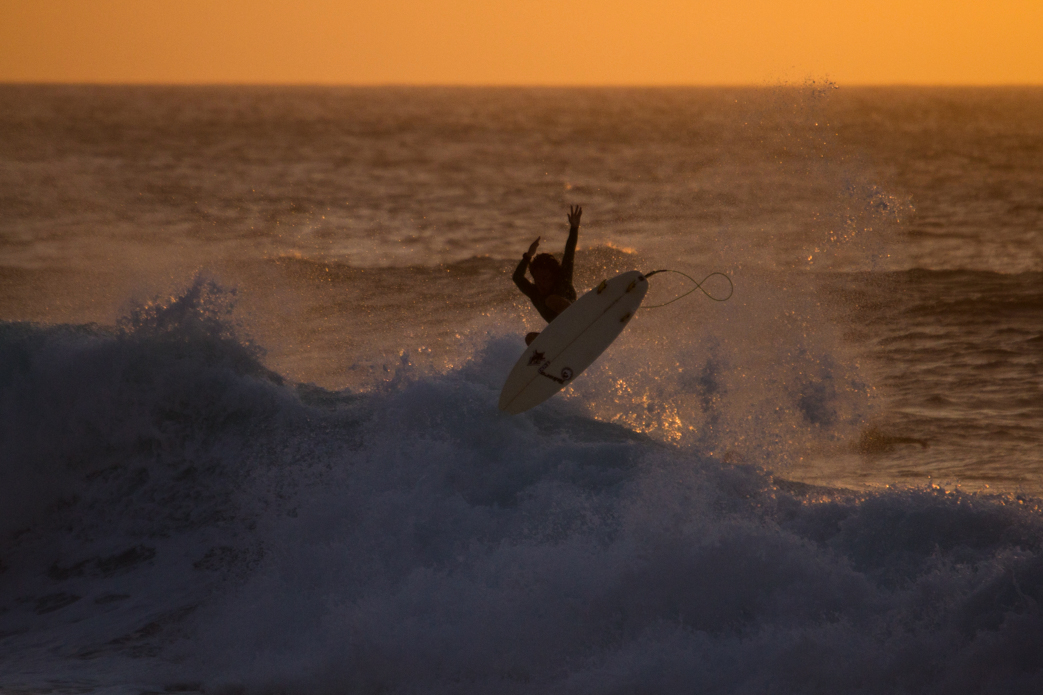 Taichi Wakita punting during golden hour. Photo: <a href=\"http://www.shigephoto.co/\">Gavin Shige</a>