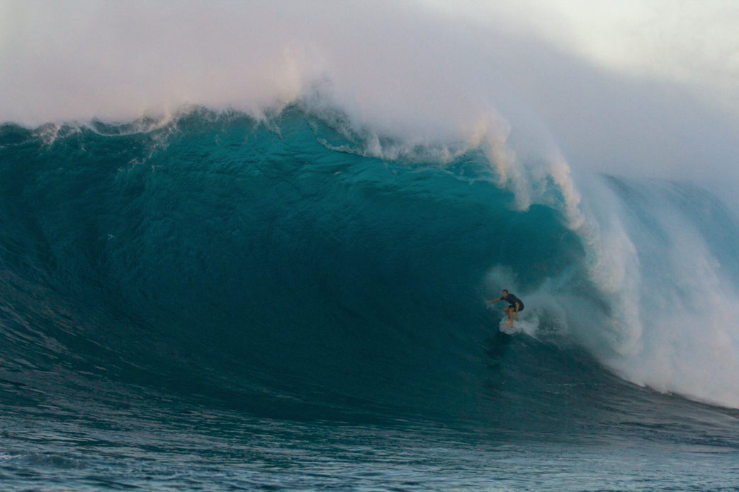 Trevor Carlson in the perfect spot in the pocket of a massive Jaws pit. Trevor has been charging all over the world. Photo: <a href=\"http://www.shigephoto.co/\">Gavin Shige</a>